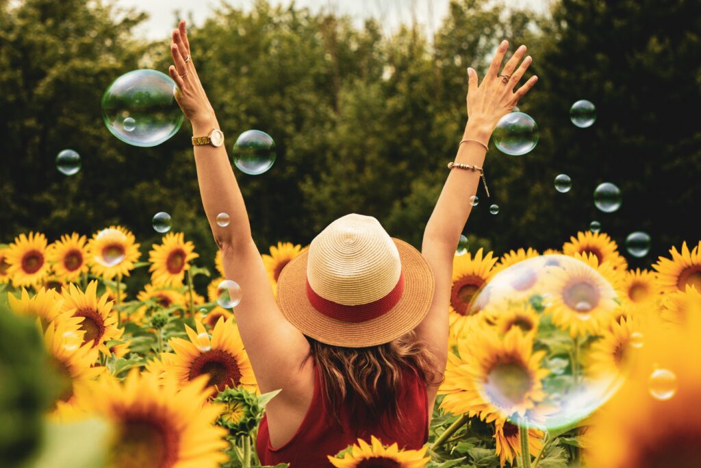 Lifestyle factors to consider- for immunity & wellbeing 8 woman in sunflower field lifestyle for immunity and wellbeing